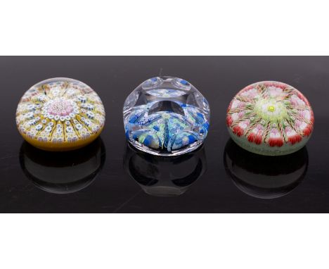 A group of three millefiori glass paperweights including a Whitefriars faceted weight 7.5cm; and two similar Scottish weights