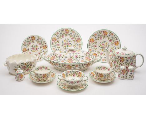 A Minton Haddon Hall pattern dinner service comprising of six 20cm plates, twelve 16.5cm plates, six soup bowls with stands, 