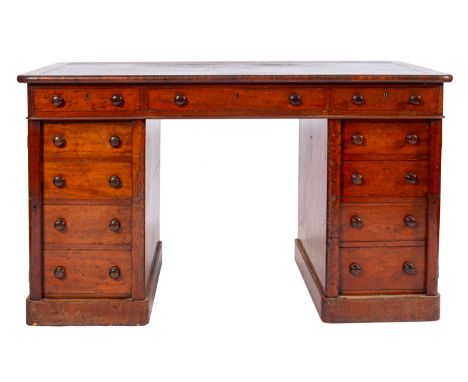 A Victorian mahogany pedestal desk, last quarter 19th Century; the rectangular top with inset faux leather skiver; above an a
