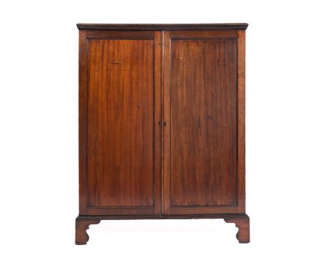 A mahogany housekeeper's cabinet in George III style, later 19th century; the top with moulded edges, above twin panel doors,
