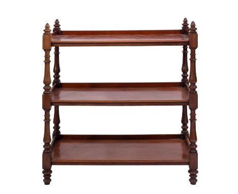 A Victorian mahogany three tier buffet, mid 19th century; with turned finials at the upper corners, the shelves with three qu