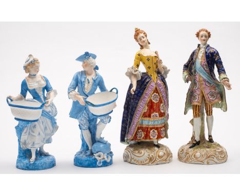 A pair of Paris porcelain figures of dandy and companion on gilt decorated rococo bases, faux Derby marks to bases, late19th 