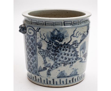A Chinese porcelain jar of cylinder form with mask handles painted in blue front and verso with a panel containing a Qilin in