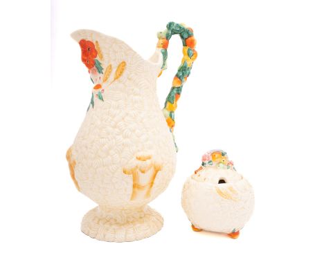 A Clarice Cliff Harvest pattern jug and sugar bowl, the bowl complete with lid, jug height 28cm.