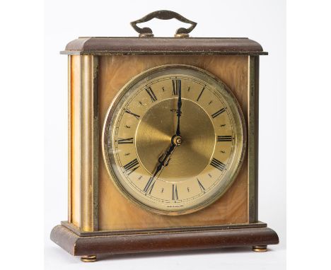 Metamec, a contemporary brass mantle clock having a Junghans Transistor movement, the round dial having a silvered chapter ri