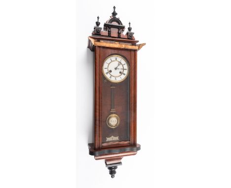 An Edwardian mahogany and glass Vienna-style wall regulator having an eight-day duration skeletonised spring driven movement 