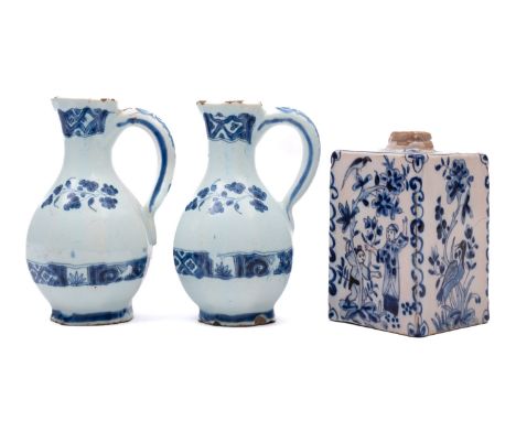 A pair of 18th century Dutch blue and white delftware cruet oil bottles and a small 19th century tea canister the bottles pai
