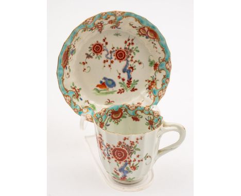 A First Period Worcester 'Two Quail' coffee cup and saucer of lobed form with entwined branch handle, painted in kakiemon sty