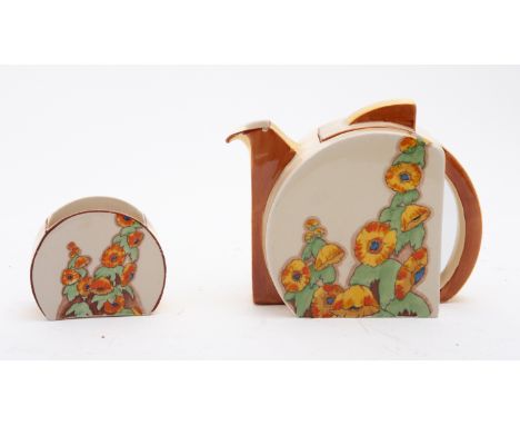 A Clarice Cliff Stamford shape teapot, cover and sugar bowl enamelled in the Sunshine pattern, brown Bizarre backstamps, circ