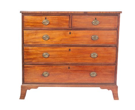 A Regency mahogany chest of drawers, early 19th century; the two short and three graduated long drawers all with brass swing 