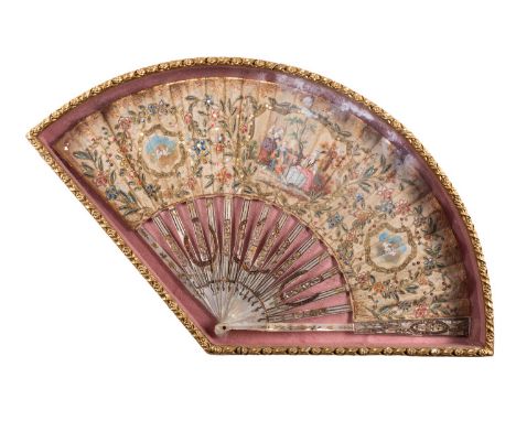 A painted, embroidered and mother-of-pearl mounted fan, late 18th century; decorated centrally with Watteauesque figures in a