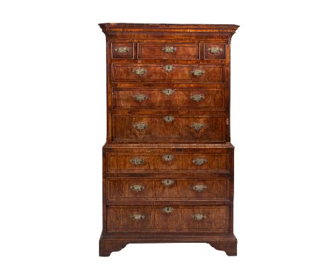 A George II walnut and crossbanded chest on chest, mid 18th century; the upper section with canted and ogee moulded cornice a