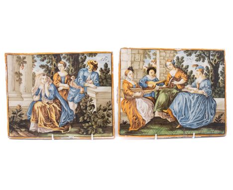 A pair of Castelli maiolica rectangular plaques, mid 18th century painted with figures within classical ruins, landscape beyo