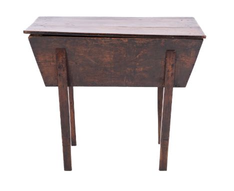 A George III oak dough bin, early 19th Century; of rectangular form, the plank top lifting to reveal a tapering basin raised 