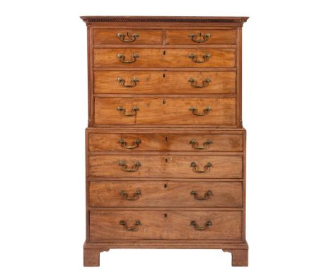 A George III mahogany chest on chest, circa 1800; with moulded and dentilled cornice, above two short and three graduated lon