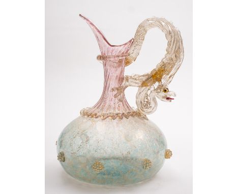 A Facon-de-Venise ewer. The gilded body encrusted with strawberry prunts, the handle in the form of a dragon, 25cm high.