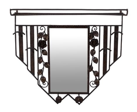 A French wrought iron wall mounting hat and coat rack, late 19th Century; of openwork form throughout, the rectangular hat sh