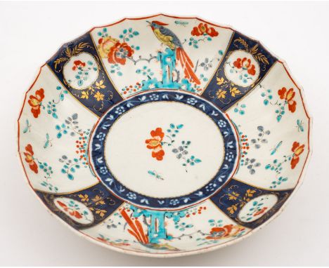 A First Period Worcester fluted saucer dish painted in Kakiemon style with the 'Sir Joshua Reynolds' pattern with panels of l