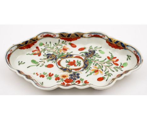 A First Period Worcester spoon tray of fluted hexagonal form, painted in the Imari palette with flowers and wispy foliage, un