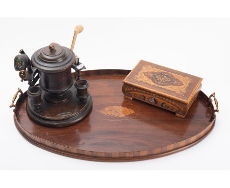 A George III mahogany oval tray, circa 1800; with marquetry conch shell and a raised brass handle at each end, 6cm high overa