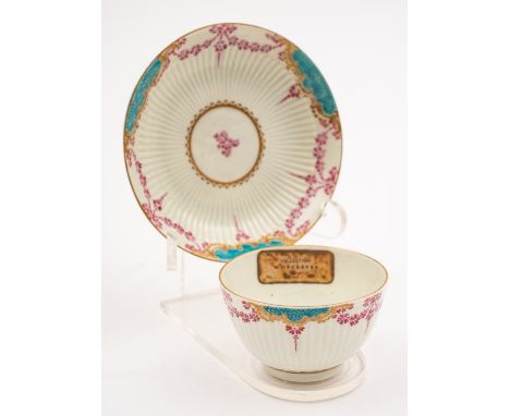 A First Period Worcester teabowl and saucer of semi-reeded form, painted in the Sèvres manner with turquoise imitation shagre
