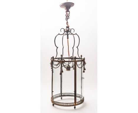 A gilt metal and glazed cylindrical hall lantern in George III style, late 19th century; with four bowed panes, one hinged as