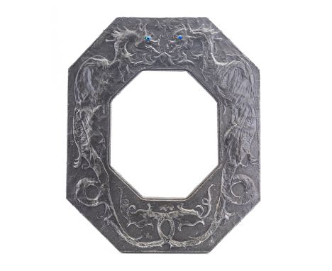 A pewter octagonal mirror frame in Arts & Crafts style, circa 1900; the broad fascia repousse worked with stylised dragons, w