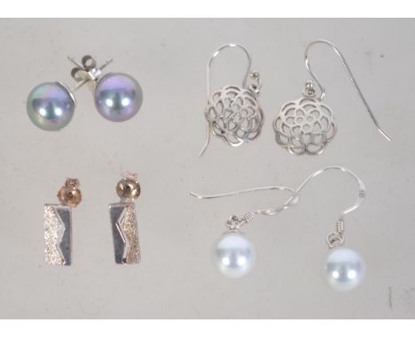 A group of 4 silver 925 pairs of earrings to include two ball bead design examples a pierced Celtic style pair and a modernis