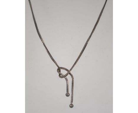 A silver 925 foxtail link ladies choker necklace with knot and ball fixed design. Measures 16 inches long, weighs 6 grams.