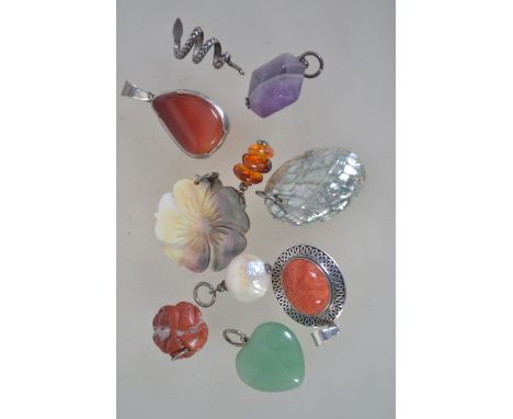 A collection of silver necklace pendants to include abalone, amethyst, agate stone, bloodstone, pearl, mother of pearl, silve