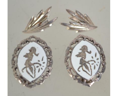 Two pairs of silver earrings one being a silver and white enamel clip on pair marked sterling 925 and the other being in the 