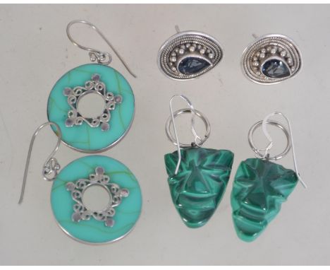 A pair of malachite and silver earrings of drop form on large silver scrolls together with a pair of hoop turquoise and silve