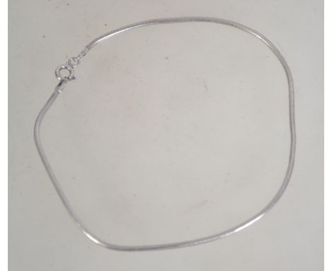 A 925 Italian silver snake chain anklet Marked 925 Italy. Weight 4.7g. Measures 9.5 inches.