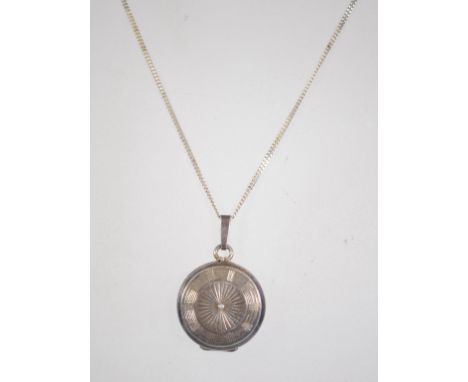 A silver 925 curb link necklace chain with hoop clasp having a silver circle shield locket. Chain measures 16 inches weighs 5