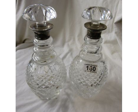 Pair of silver topped decanters