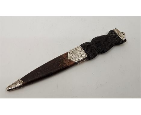 An Edwardian Scottish silver mounted Sgian Dubh, by Henry Tatton, assayed Edinburgh 1909, with carved horn grip, steel single