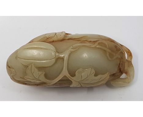 A Chinese celadon jade pebble carving, probably 19th century, carved as a melon and butterfly, length 8.7cm.Condition: Good n