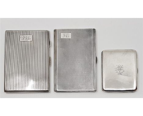 An engine turned rectangular silver cigarette case, by Walker &amp; Hall, assayed Birmingham 1938, together with a similar si