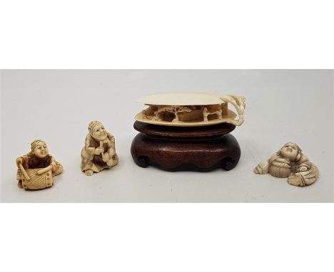 Three Japanese Meiji period carved ivory netsuke,&nbsp;fashioned as various figures, two signed to base, together with a Japa