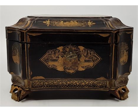 An 18th century Chinese chinoisserie gilded black lacquer tea caddy, raised upon four out swept&nbsp;supports of typical form