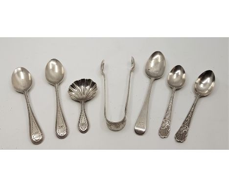 A Victorian silver caddy spoon,&nbsp;having shell shaped bowl and bright cut decoration, together with a matching pair of sil