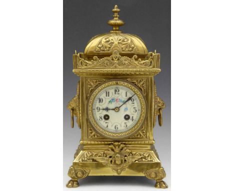 French cast brass rococo style mantel clock, late 19th century, the square section case moulded with masks and scrolls, paint