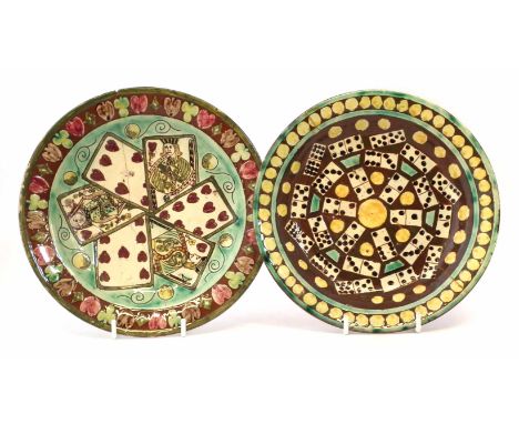 Two Della Robbia plates, incised and painted by Annie Smith with dominos and playing cards from the suite of hearts, incised 