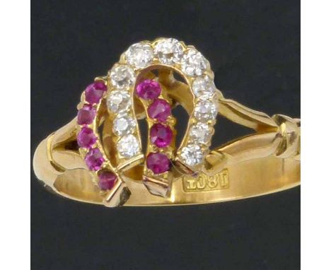 18ct gold ruby and diamond ring set with two conjoined horseshoes, old cut, ring size L, gross weight 3.6g.