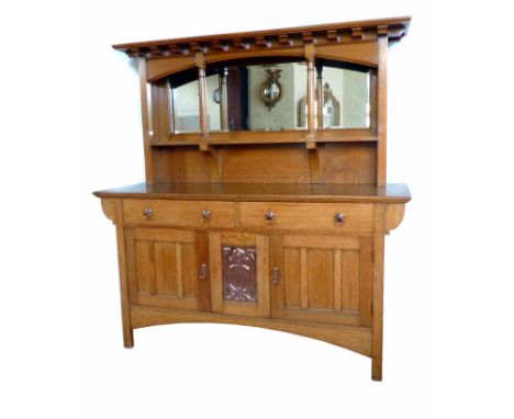 Arts & Crafts sideboard in the manor of Shapland & Petter of Barnstaple, Devon.  Dentil cornice above bevel plate glass mirro