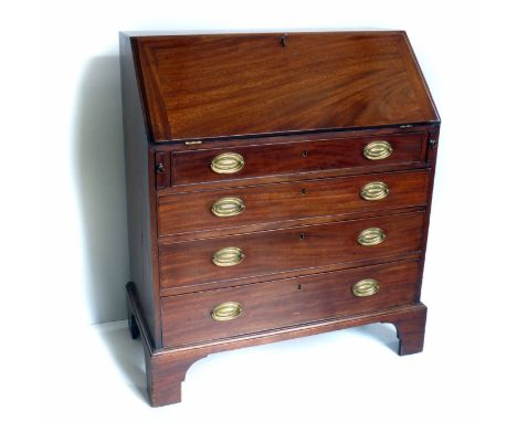 George III mahogany bureau.  Flap opening to reveal fitted interior, six drawers and six stationery compartments flanking cen