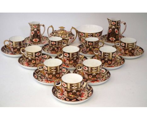 Crown Derby tea service, painted with imari pattern 2451, to include eight tea cups, eight saucers, two coffee cups and four 