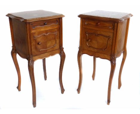 Two late 19th century nearly matching French walnut bedside cabinets.  Hard stone inset tops, oak lined single drawer above c