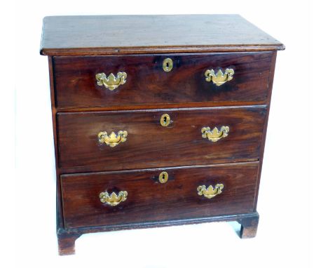George III mahogany and walnut chest of three long drawers, moulded one piece top above pine lined drawers, steel locks, bras