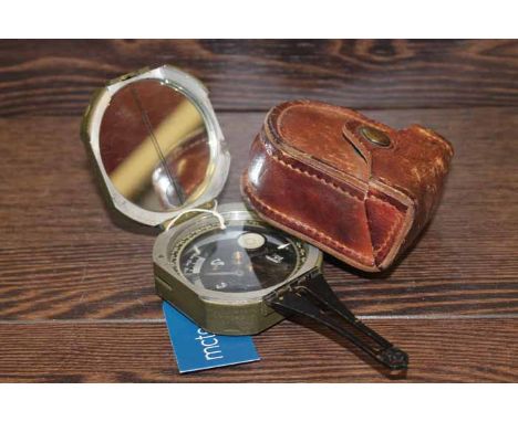 THE KALART COMPANY MILITARY ISSUE COMPASS
with its original brown leather case; together with two USA issued medals and ribbo